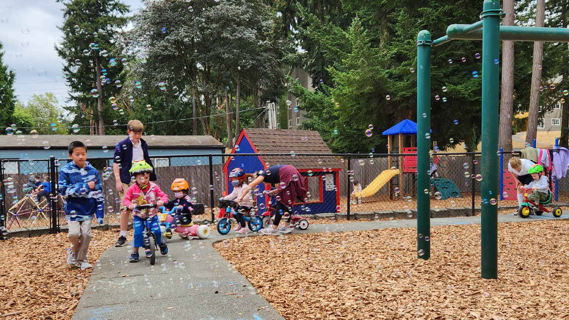 16×9 older kids with trike a thonArtboard 1-100