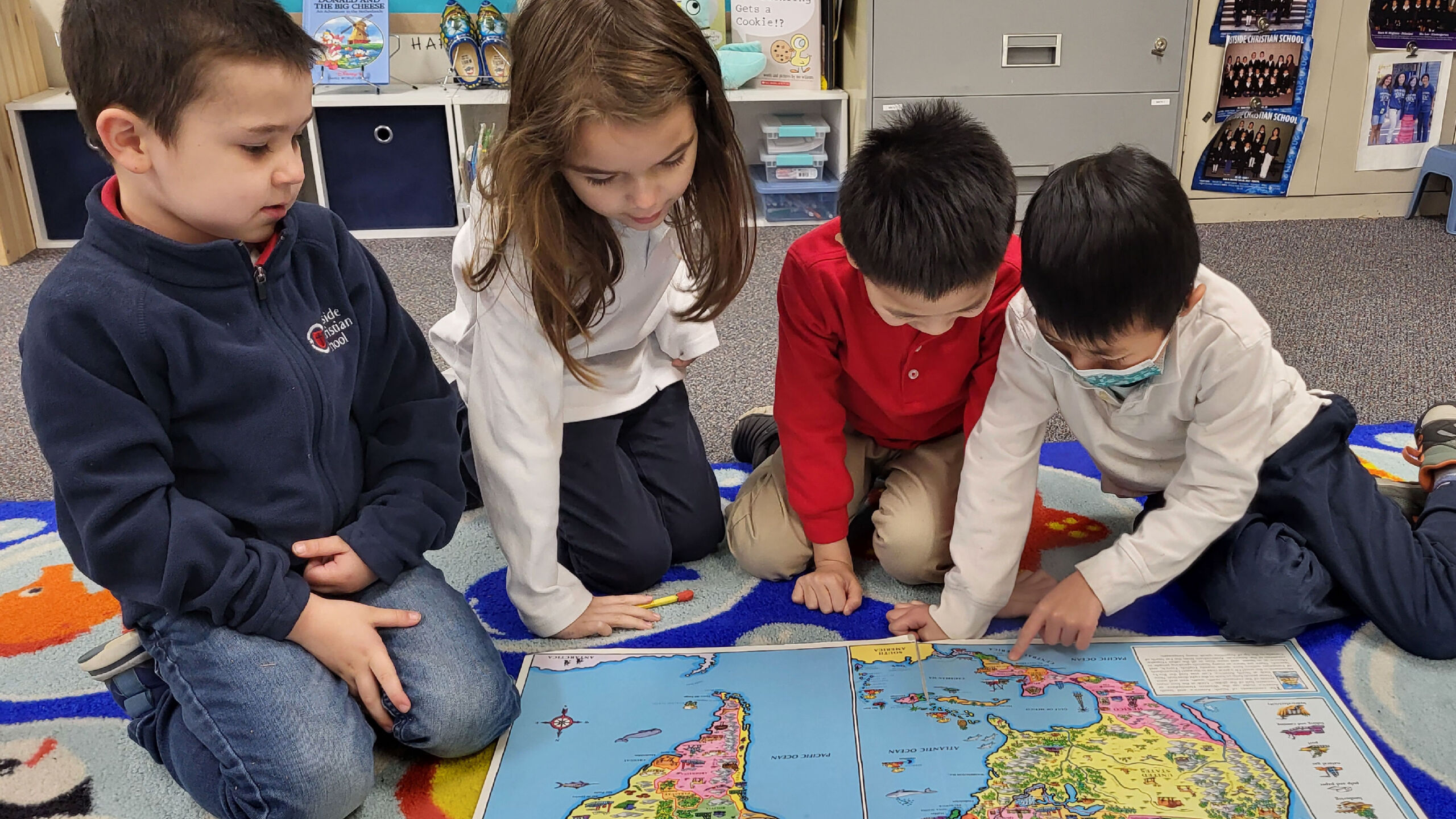 4 k students looking at maps-01