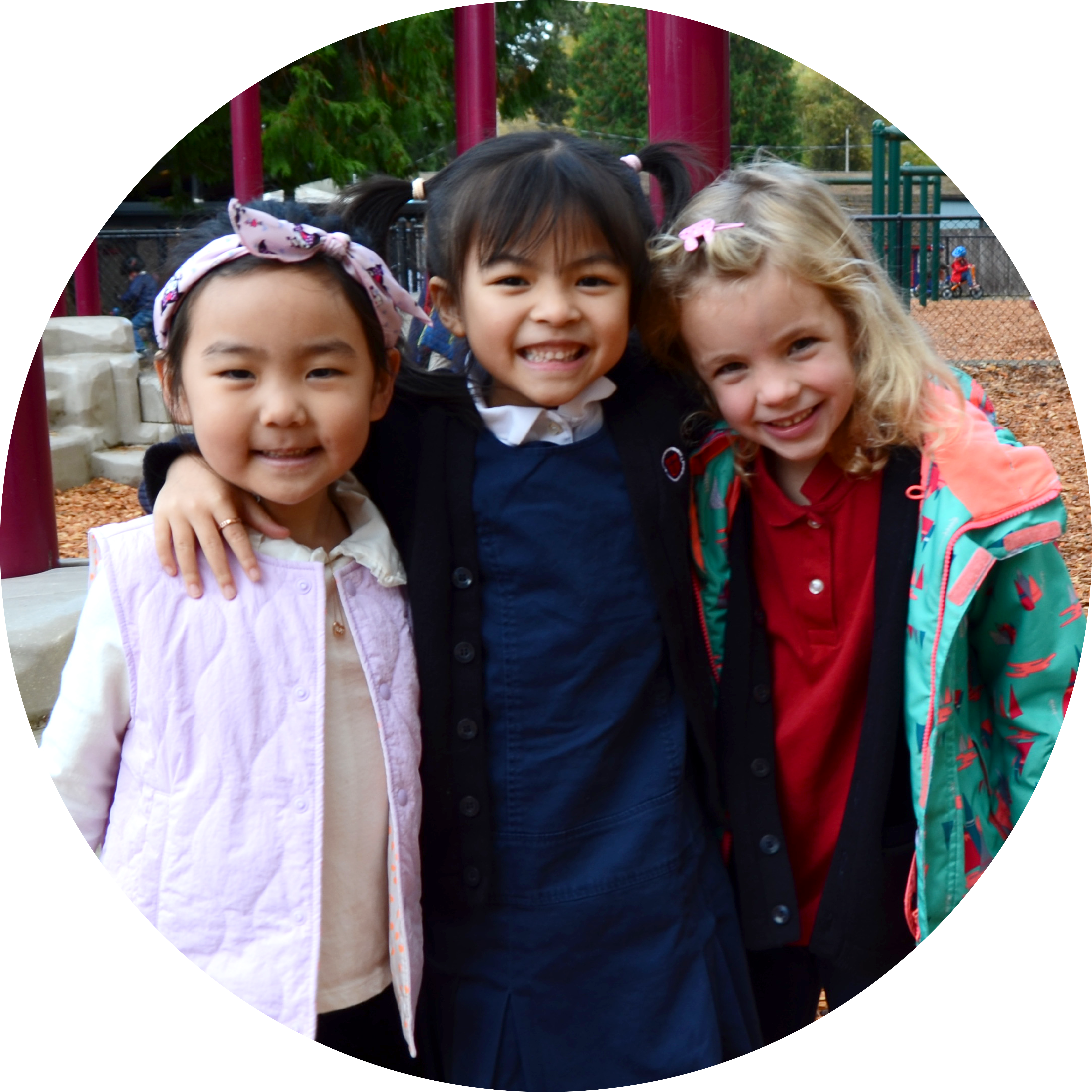 3 K girls on playground, circle 2.0Asset 2@3x